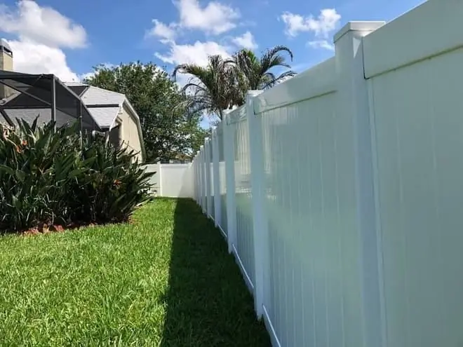 Bright white vinyl fence after cleaning
